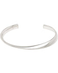Silver twisted design bangle on a white background