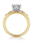 Gold ring with a diamond on a white background