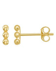 Gold bead bar earrings on a white background one straight forward one sideways