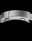 Close-up of a metallic watch band with 'Seiko' branding on a black background