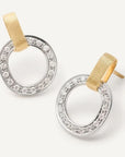 Pair of gold and silver hoop earrings on a light gray background