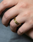 Logan James Urban black diamond 18K yellow gold ring worn on hand close-up