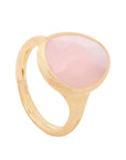 A gold signet ring featuring a large, smooth, oval-shaped pale pink stone, photographed on a clean off-white background.