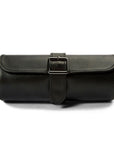 Black leather roll with a buckle on a white background