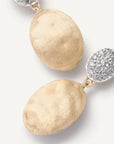 A pair of gold drop earrings with large textured oval dangles and round pavé-set clear stones, photographed on a clean white background.