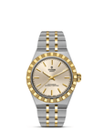 Tudor watch with silver and gold band on a white background