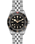 Tudor watch with black dial and silver open bracelet on a white background