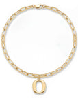 A gold paperclip chain necklace with a polished lowercase letter 'o' pendant, displayed on a clean white background.