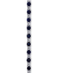 close-up of round sapphires and diamonds prong set bracelet on a white background