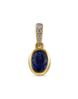 yellow gold pendant with diamond accents and and oval blue stone on a white background