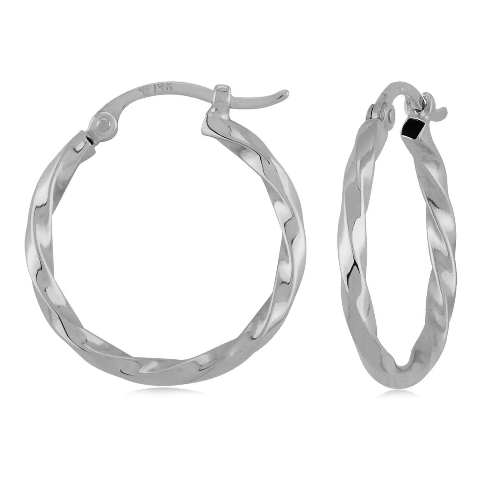 white gold hoops with twisted design on a white background