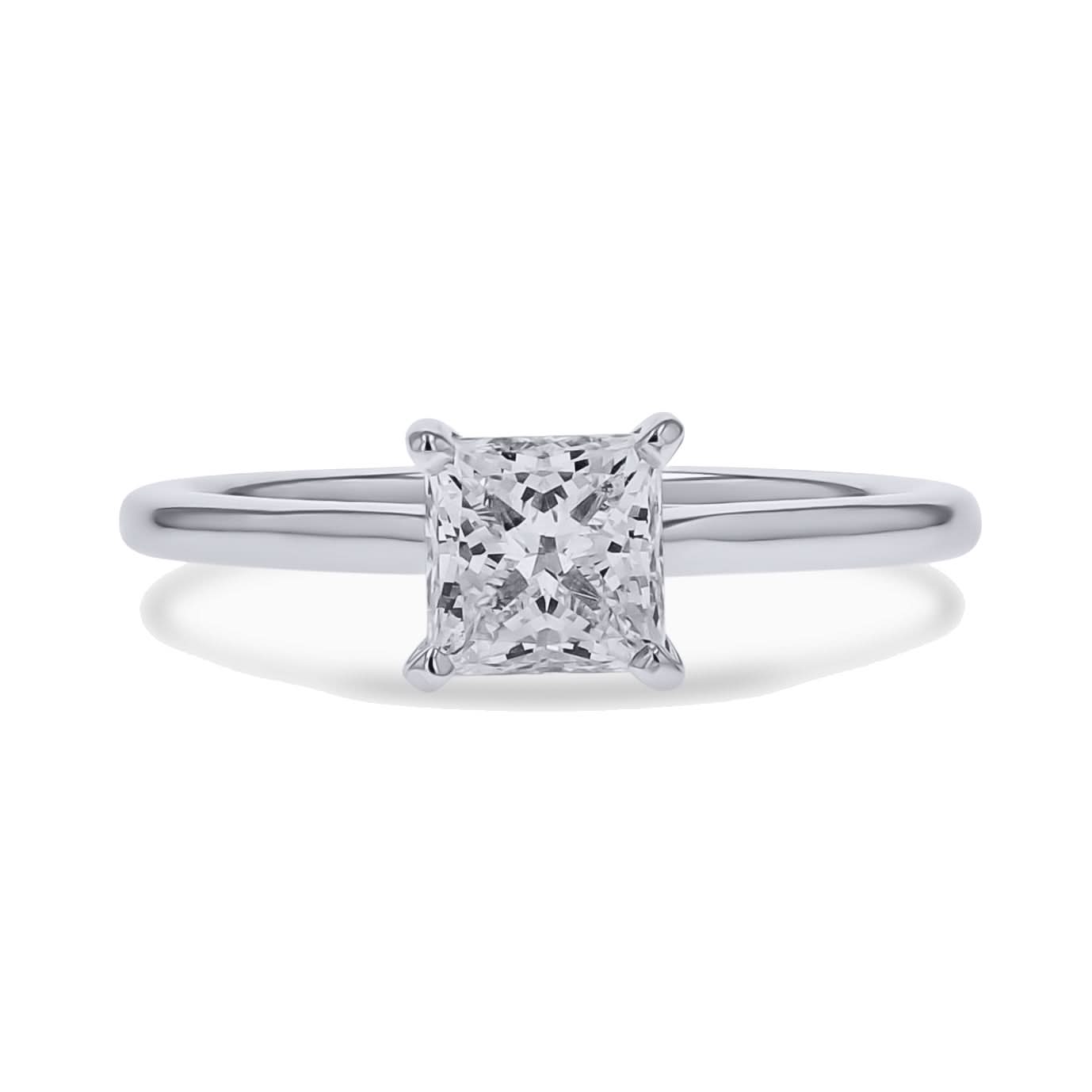 Diamond ring with a white gold band on a white background