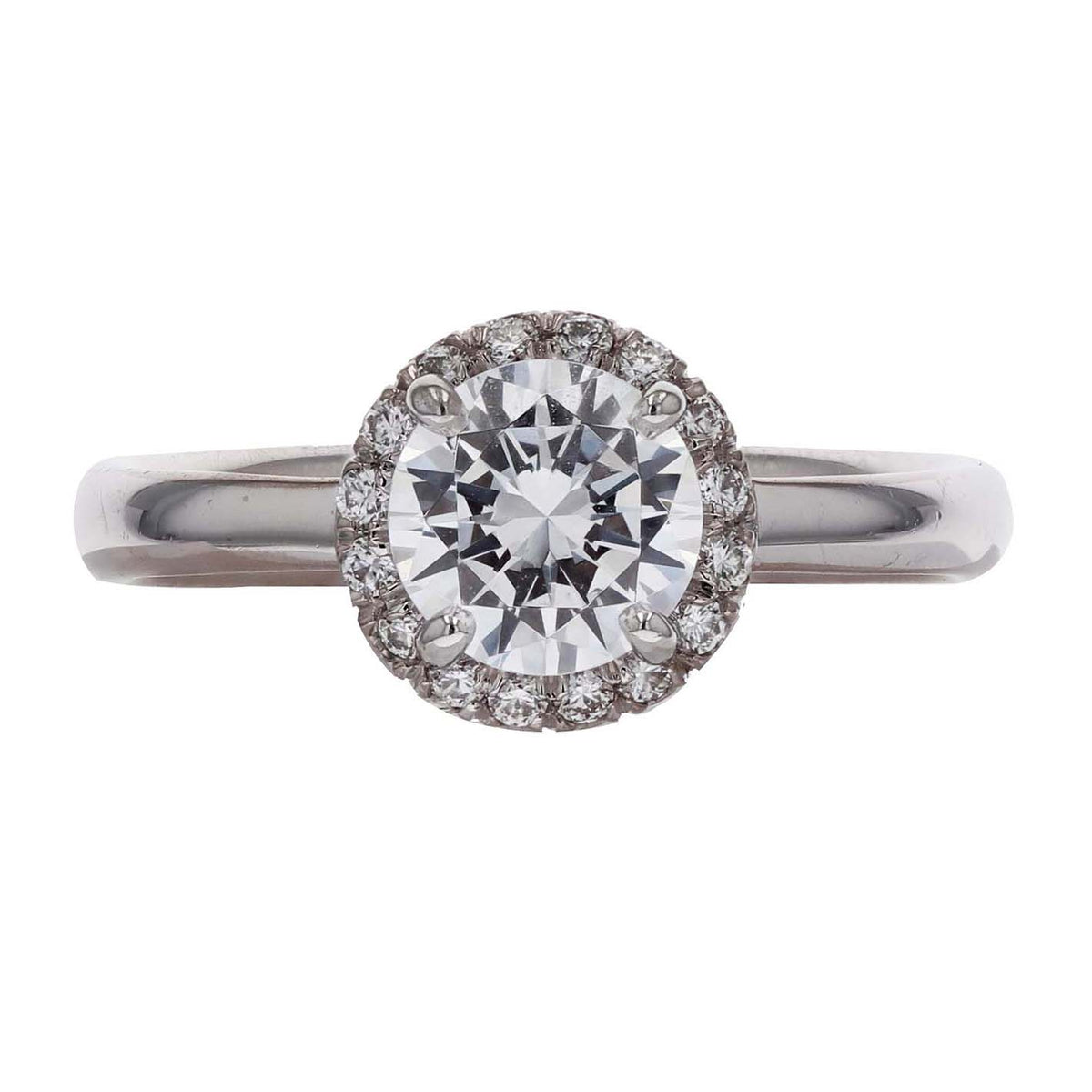 18k white gold halo engagement ring on a white background