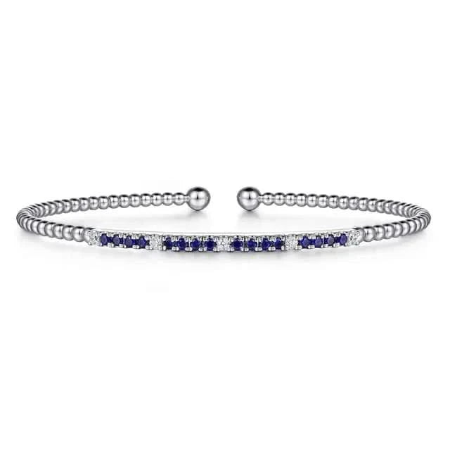 white gold bracelet with blue and white stones on a white background