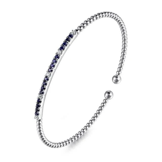 white  bracelet with blue stones on a white background
