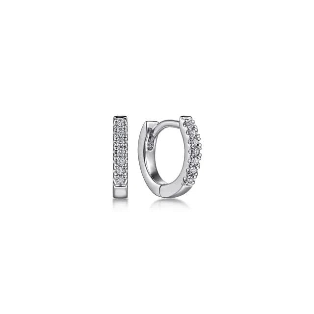 Pair of white gold  hoop earrings with embedded diamond stones on a white background