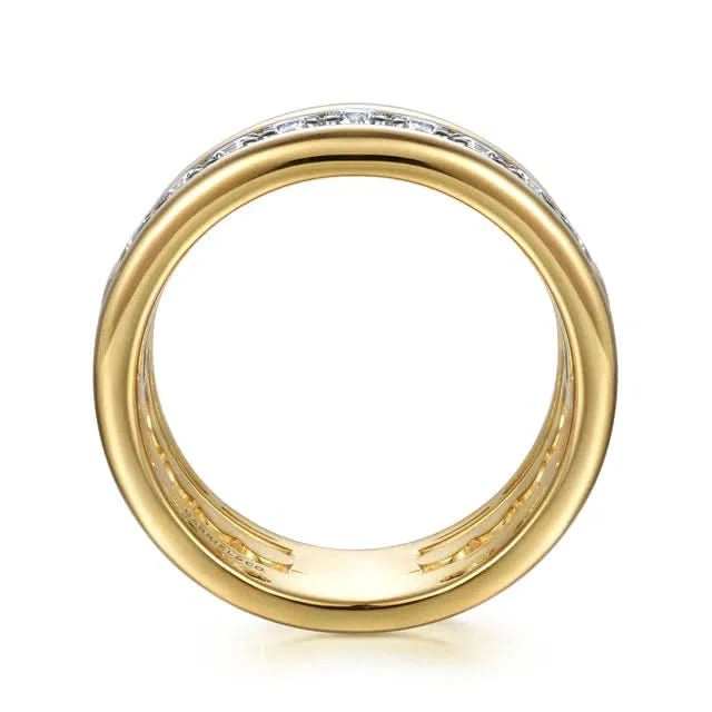 Gold ring with diamond accents on a white background