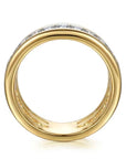 Gold ring with diamond accents on a white background