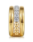 Two gold rings with diamond accents in between on a white background