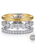 Two diamond-studded rings with a gold band on a white background, featuring an 'INSTORE DESIGN AWARD WINNER' badge.