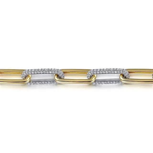 Gold and white gold diamond bracelet on a white background