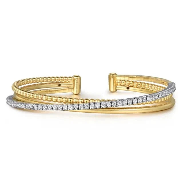 Gold and diamond bracelet on a white background