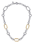 A two-tone chain link necklace featuring silver-toned oval and elongated links, accented by three polished gold-toned oval links, displayed on a clean white background.