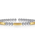 silver beaded bracelets with gold accents on a white background