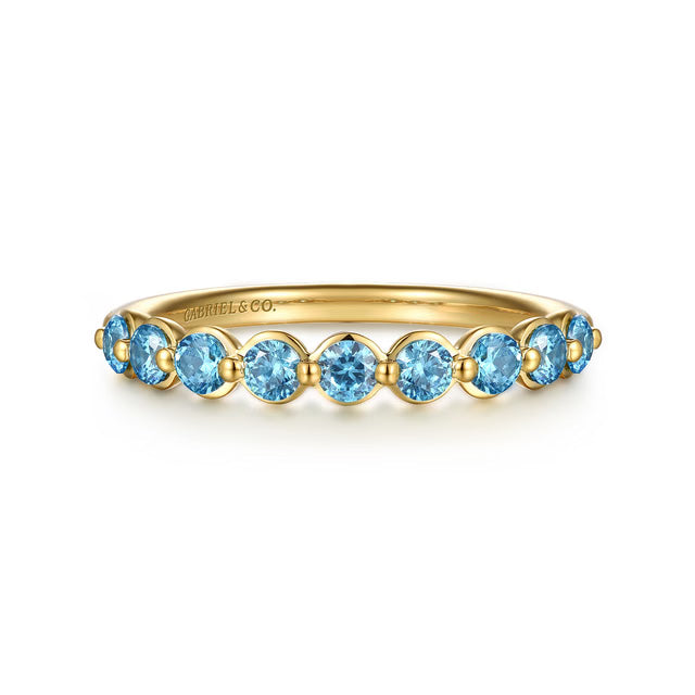 A yellow gold  ring featuring nine round-cut light blue topaz stones, shown on a clean white background. The brand name 'GABRIEL &amp; CO.