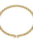 Gold beaded bracelet on a white background  side view