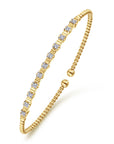 yellow gold bujukan bracelet with diamond stations and fluted designs- angled