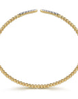 side view of yellow gold beaded open bracelet