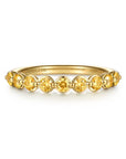 A yellow gold  ring featuring nine round-cut citrine gemstones, shown on a clean white background. The brand name 'GABRIEL & CO.