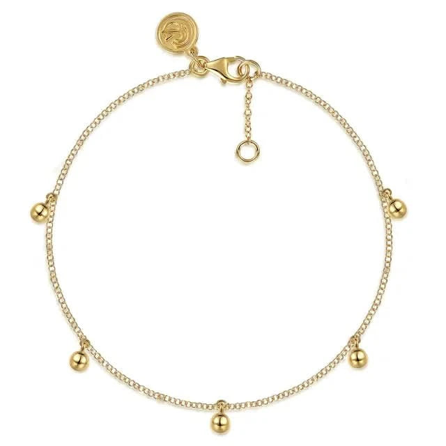 Gold bracelet with small gold balls on a white background