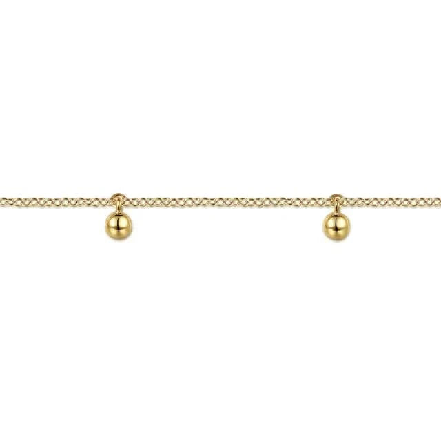 Gold bracelet with three spherical charms on a white background