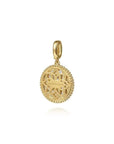 Gold pendant with intricate design on a white background