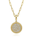 Gold necklace with a round, diamond-studded pendant on a white background