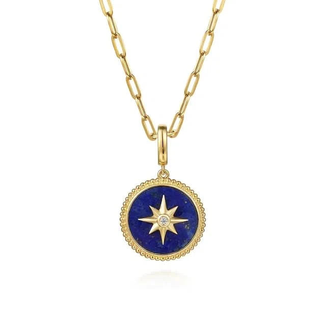 Gold necklace with a blue pendant featuring a star design on a white background