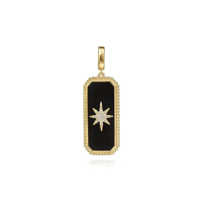 Gold pendant with black onyx  and star design on a white background