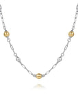 Necklace with alternating gold and silver beads on a white background close up