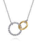 Necklace with interlocking rings, one gold and one silver, on a white background