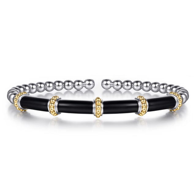 A two-tone stretch bracelet featuring a black enamel central section with gold beaded accents, flanked by silver-toned round beads on each end.