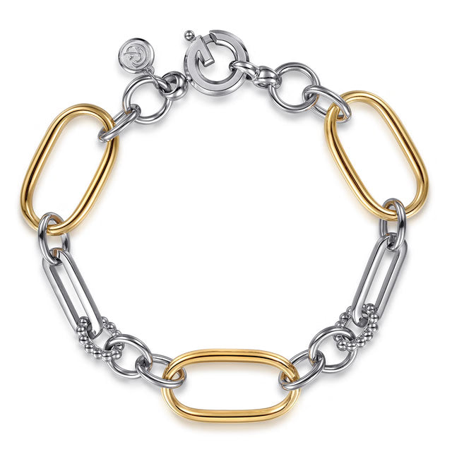 A two-tone chain link bracelet featuring polished silver and yellow gold metal links, displayed on a clean white background.