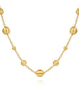Gold necklace with spherical beads on a white background
