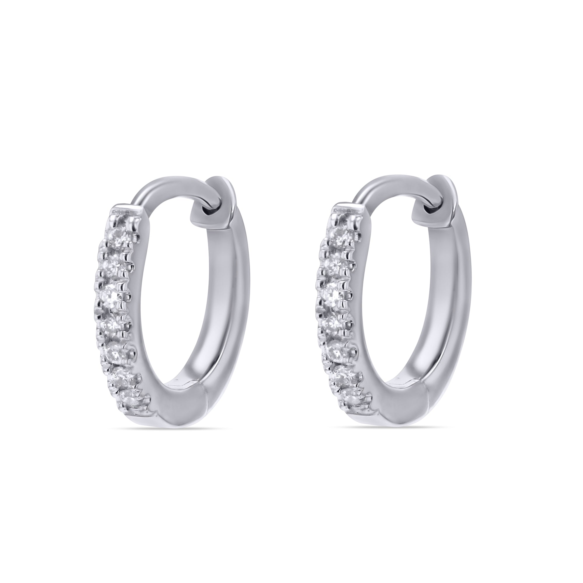 Pair of white gold  hoop earrings with clear gemstones on a white background