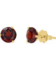 A pair of genuine round red garnet stud earrings set in 14k yellow gold 3-prong martini settings with scalloped butterfly backings, displayed on a crisp white background.