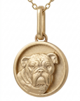 Close-up perspective view of the Skeie's Jewelers 14k yellow gold bulldog charm, highlighting the heavy dimensional folds of the jowls, the secure top bale, and the high-polish outer rim on a seamless white background.
