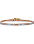 Rose gold bracelet with diamonds on a white background