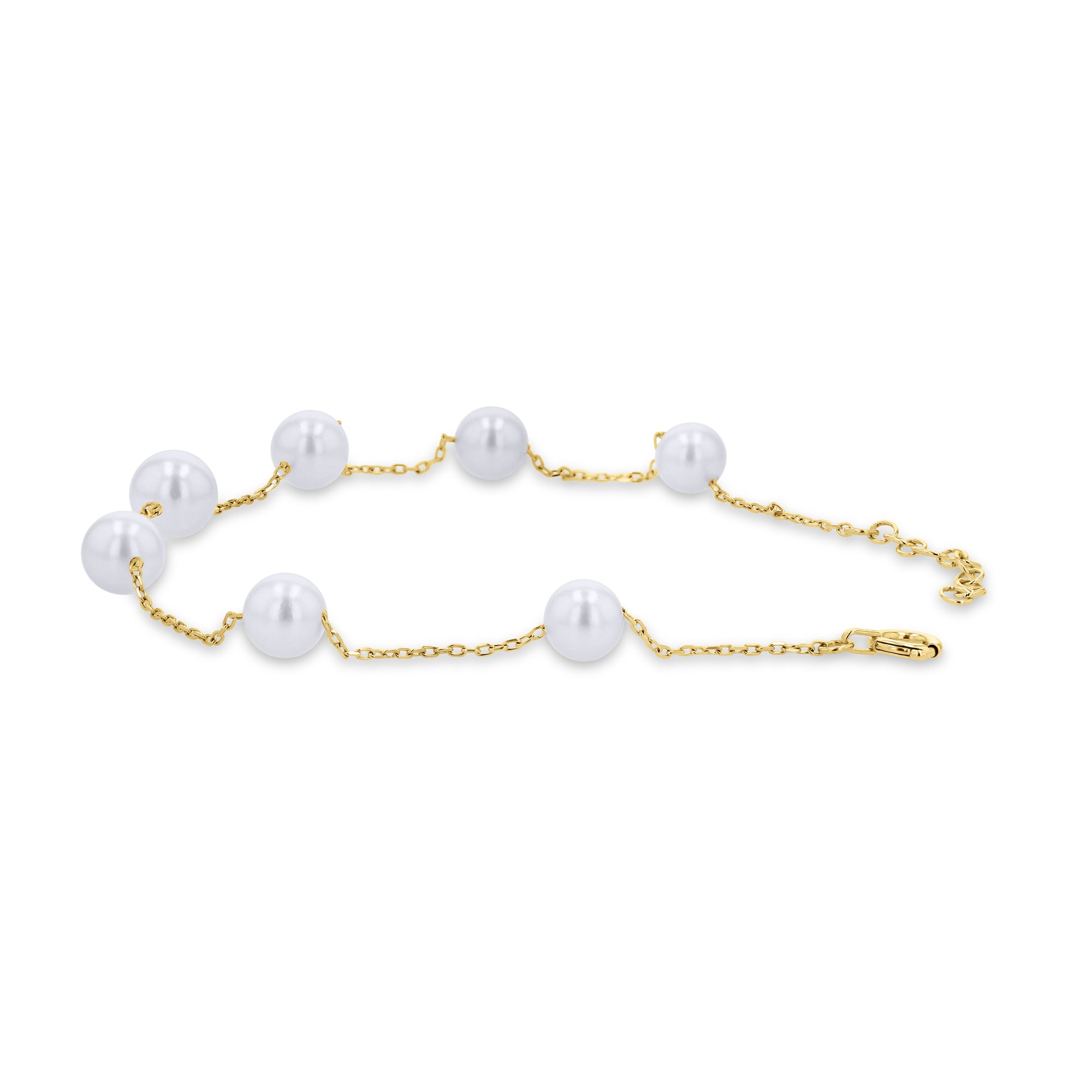 Gold chain bracelet with pearls on a white background