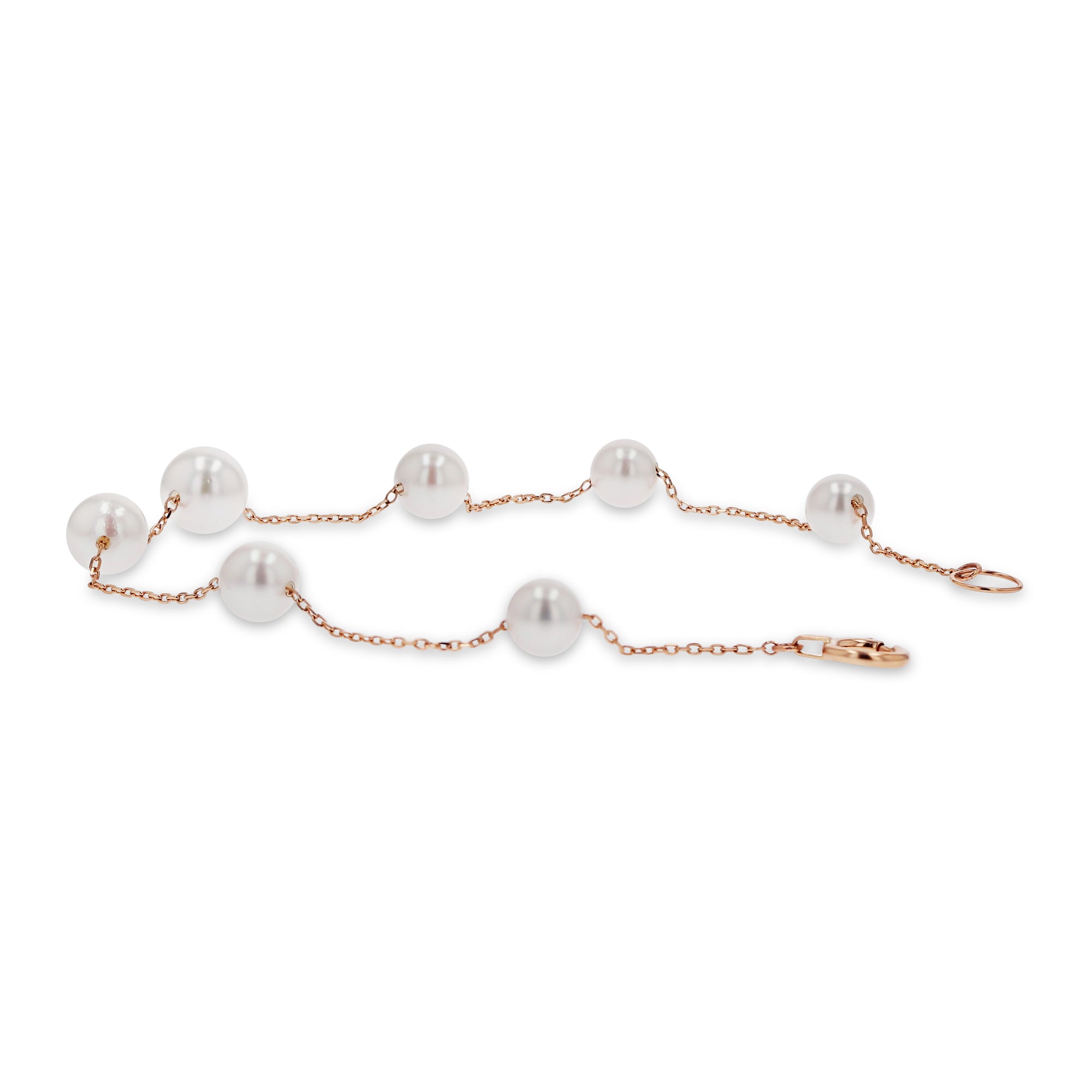 Pearl bracelet with rose gold chain on a white background
